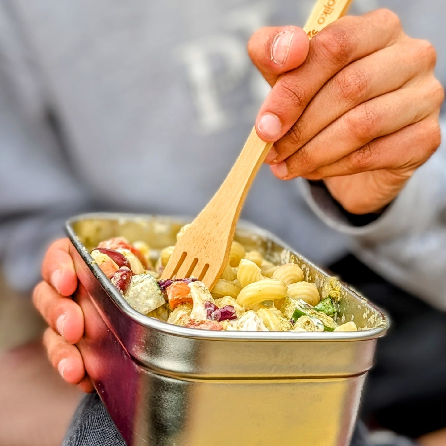 eco friendly lunch box and reusable cutlery on picnic