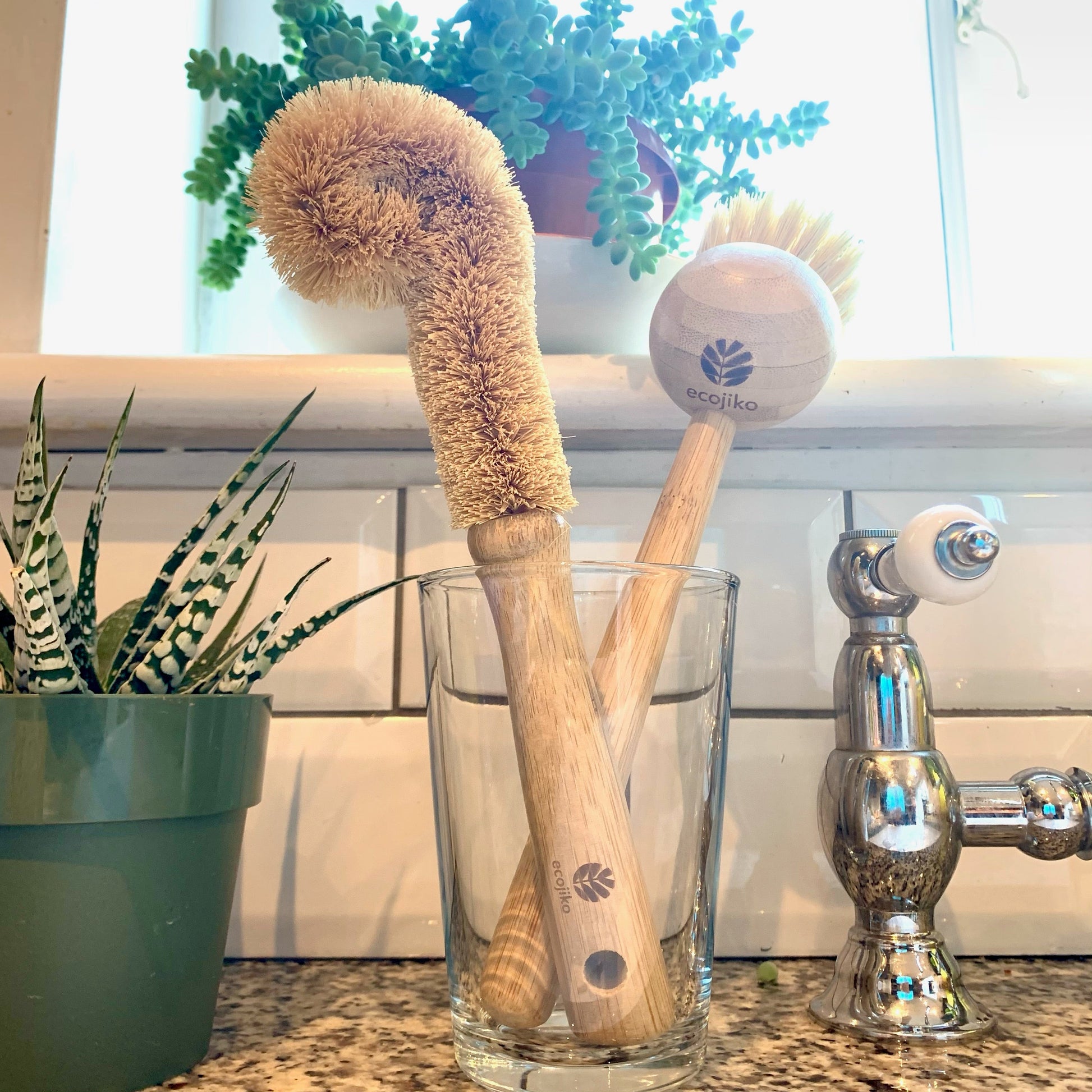 bamboo bottle brush and dish brush in kitchen