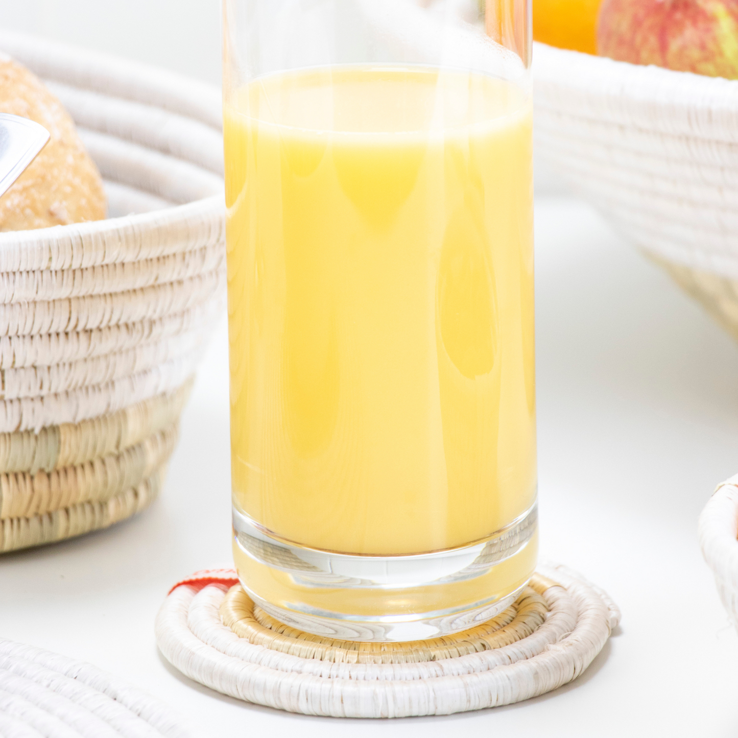 glass of juice on air trade coaster