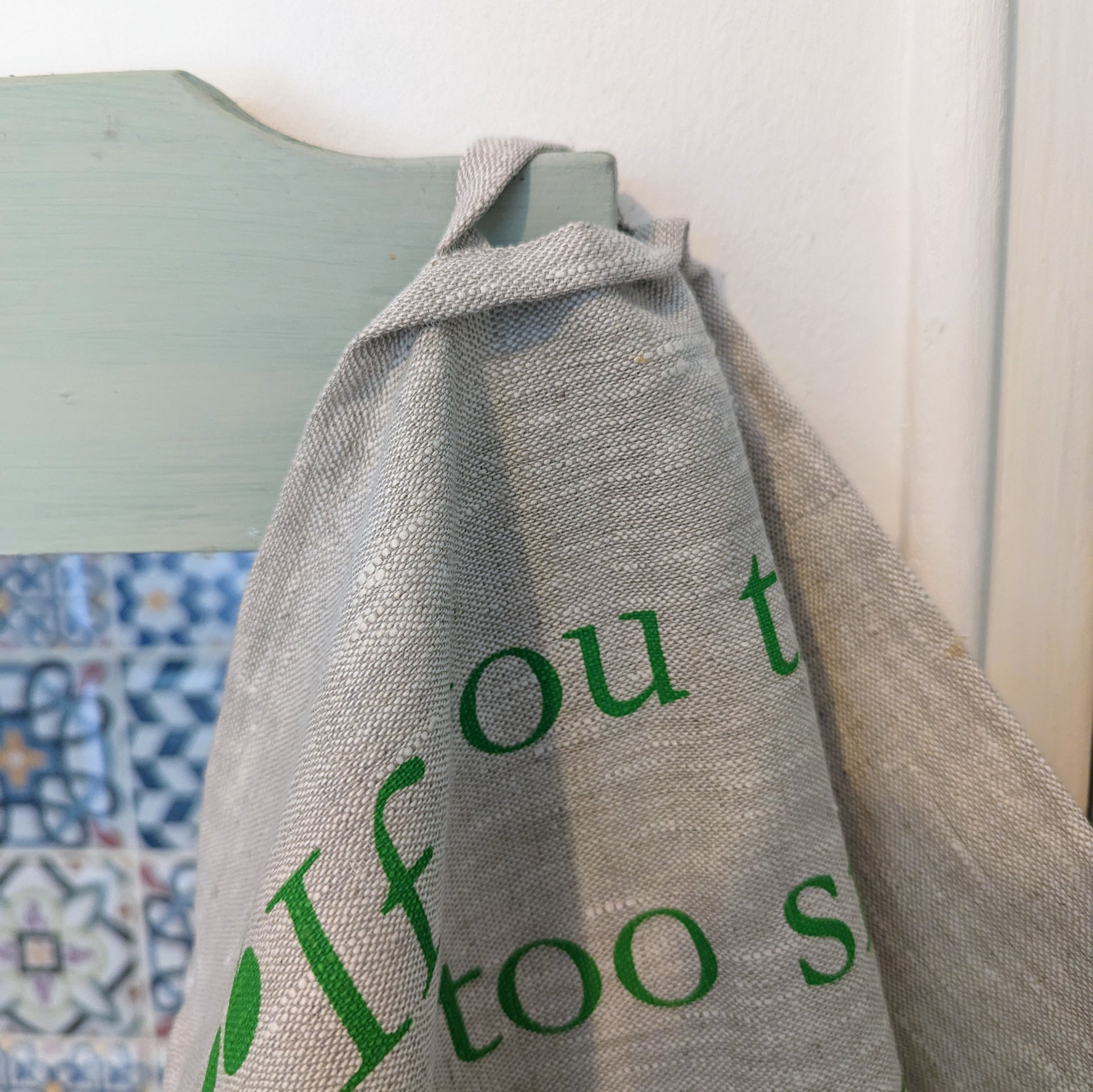 linen tea towel with eco friendly inspirational quote
