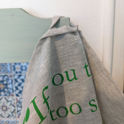 linen tea towel with eco friendly inspirational quote