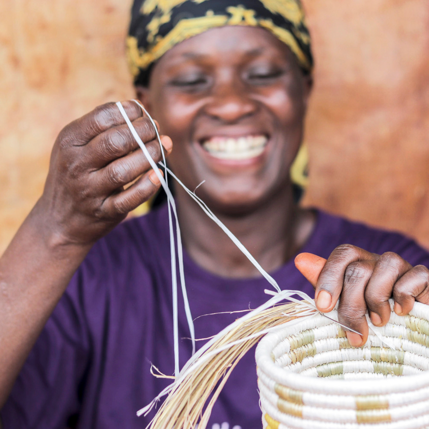 woman making Fair Trade Grass eco bowl