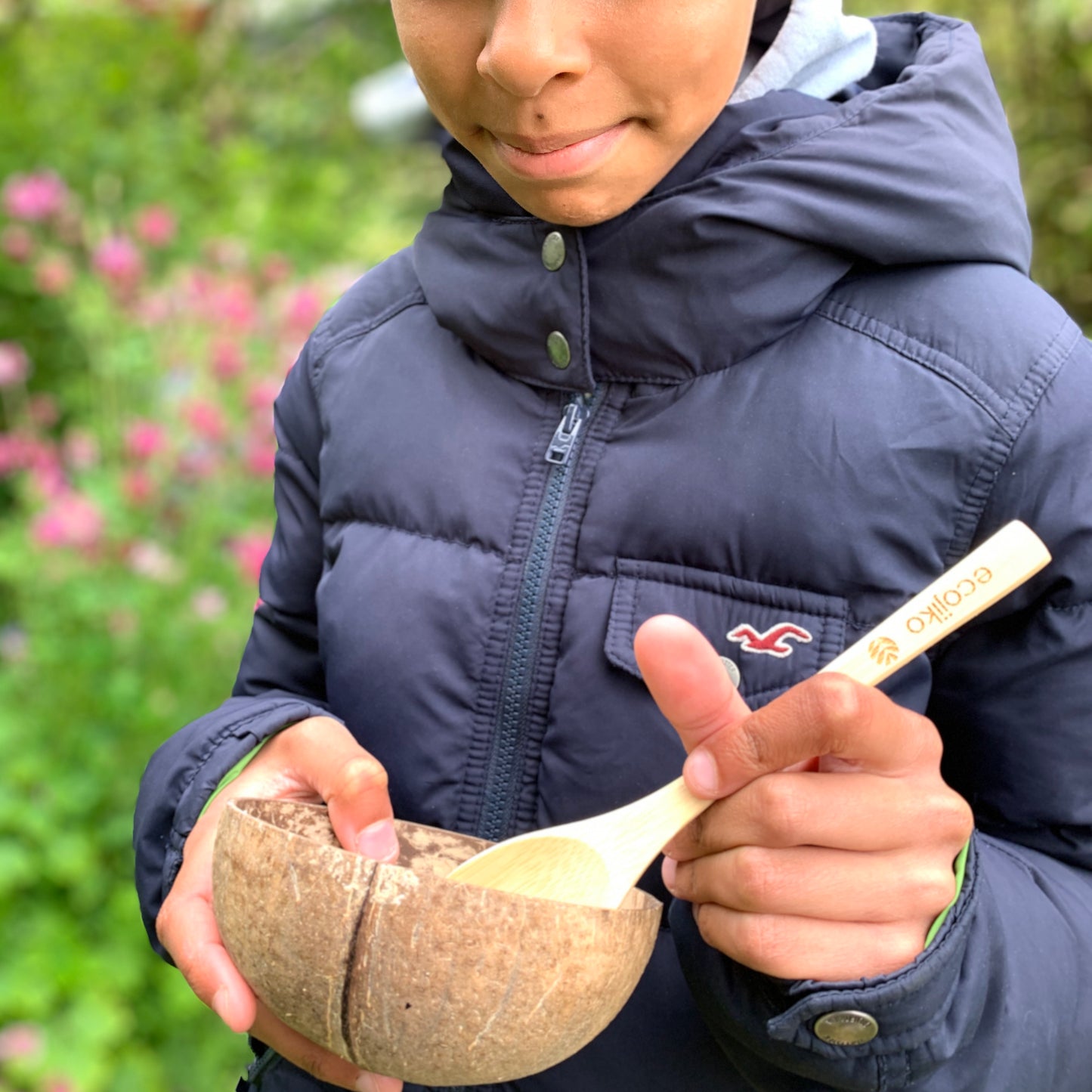 girl eating with bamboo ecojiko reusable spoon