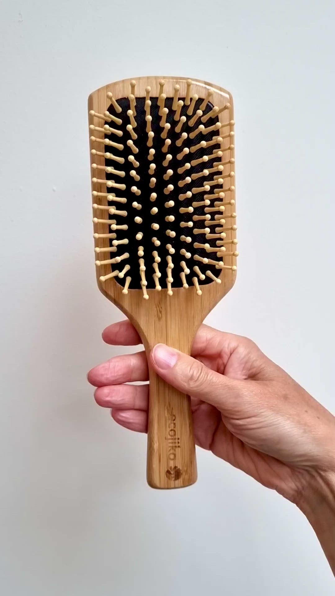 video of ecojiko bamboo hair paddle brush